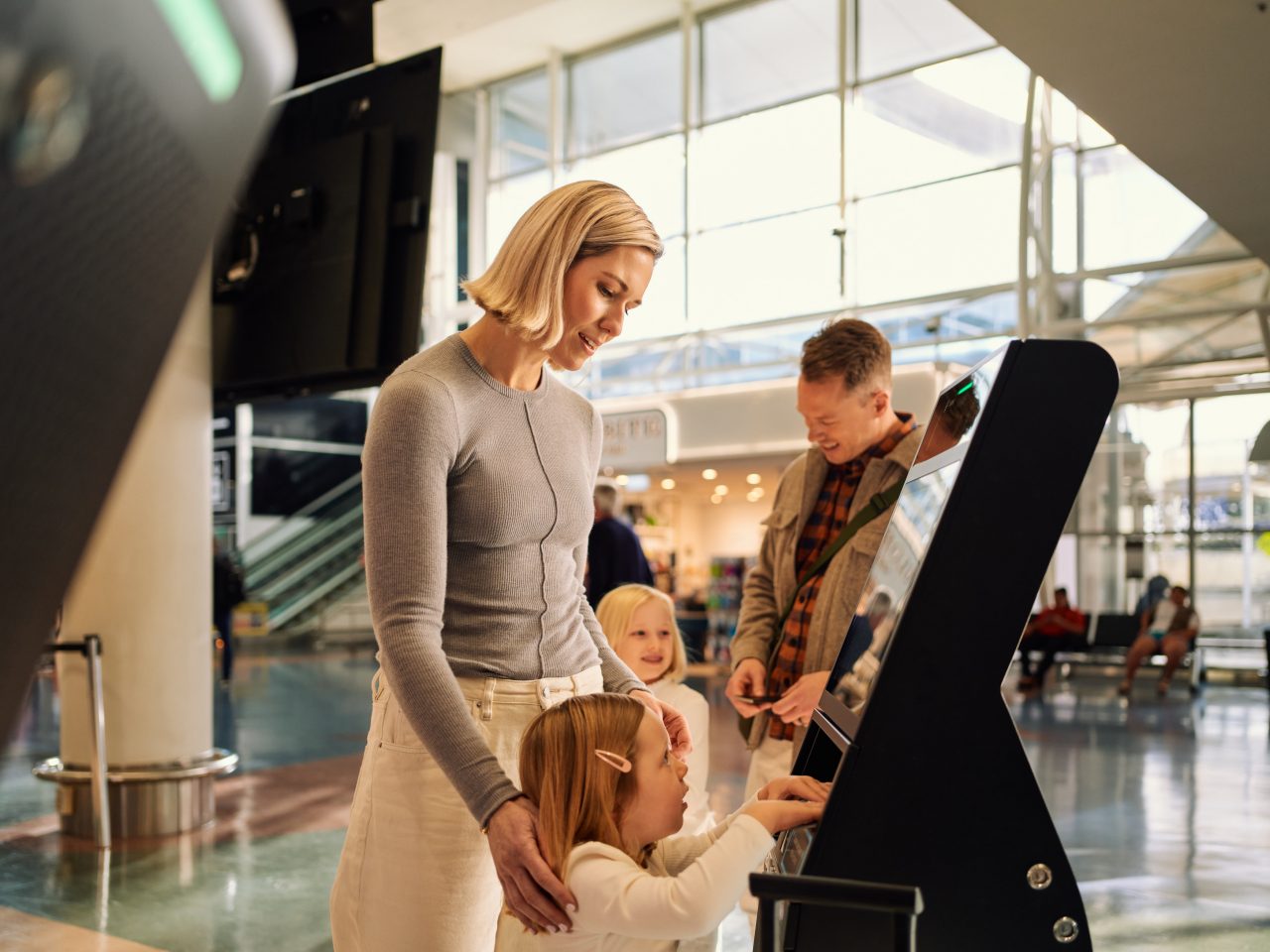 family departs from auckland airport by checking into a flight